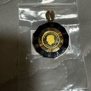 Elegant Gold and Black Roman Numeral Brooch